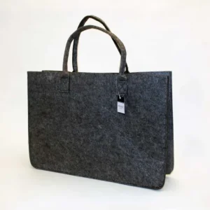 Tumman harmaasta huovanpussi 50x35x27cm valmistettu polttopuut